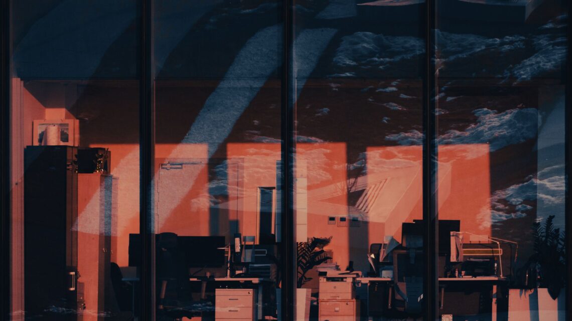 desks behind office windows