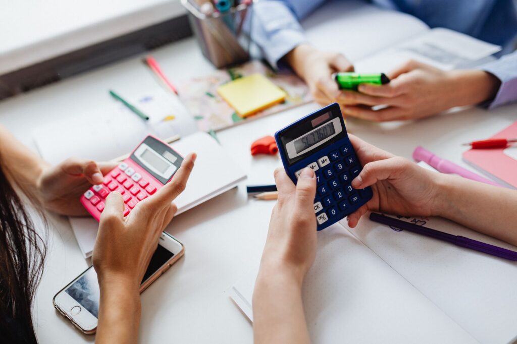 three kids solving using calculators