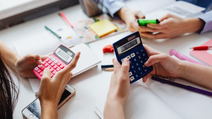 three kids solving using calculators