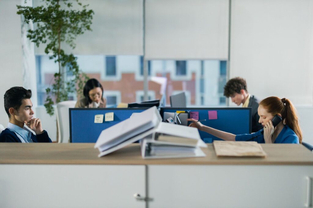 four people working in the office