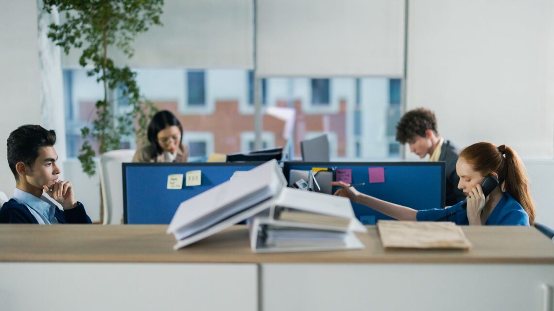 four people working in the office