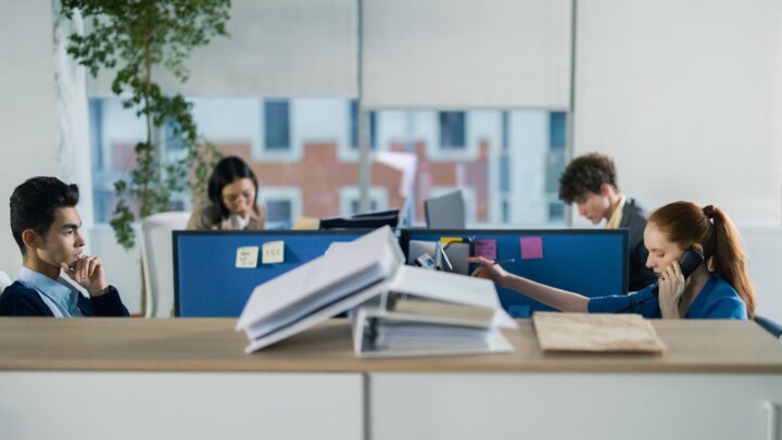 four people working in the office